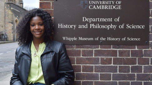 Maya Monthrope stands by the department sign