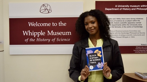 Maya Monthrope standing by the Whipple Museum sign