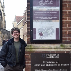 Keir Hess standing outside the entrance to the department